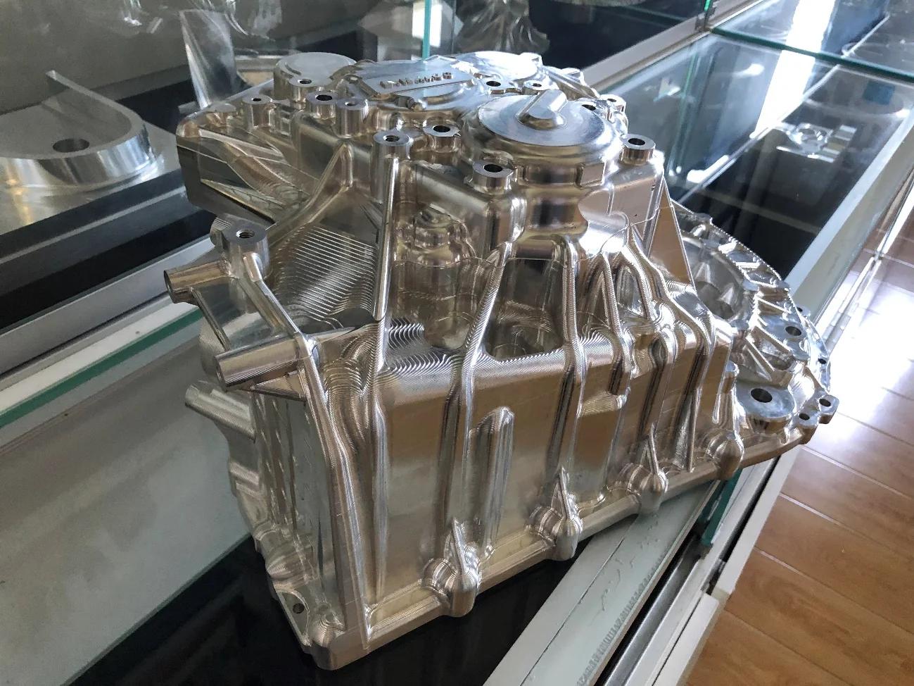 Large die-cast housing being machined on a tilting-head five-axis centre