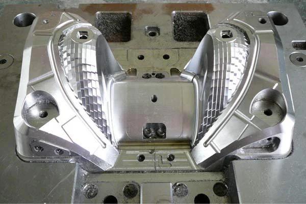 Headlamp reflector mold cavities after five-axis finishing